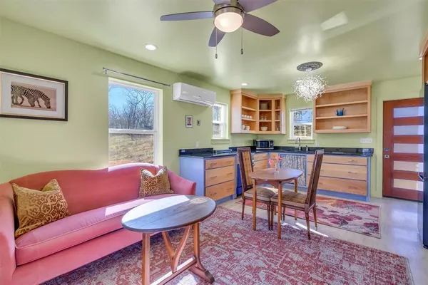 a kitchen with stainless steel appliances kitchen island granite countertop a sink and cabinets