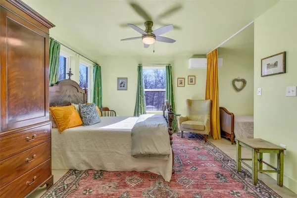 a bedroom with a bed and furniture