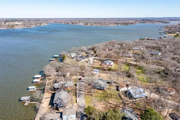 an aerial view of a houses with ocean view