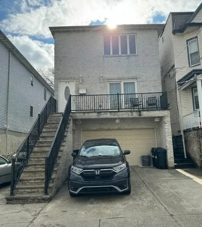 a kitchen with stainless steel appliances granite countertop a sink and a white cabinets