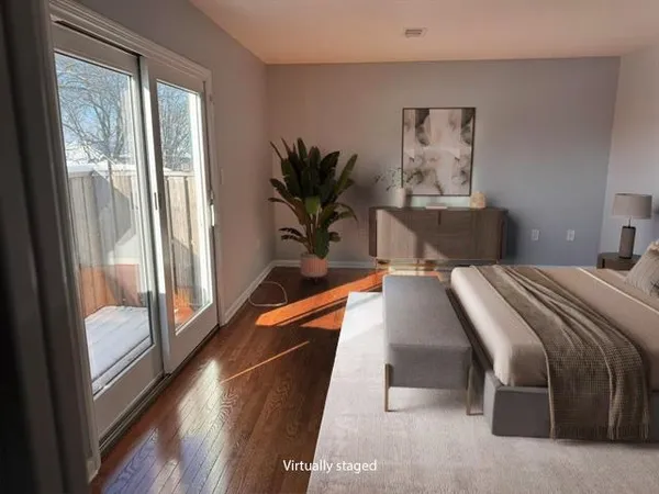 a bathroom with a sink vanity mirror and toilet