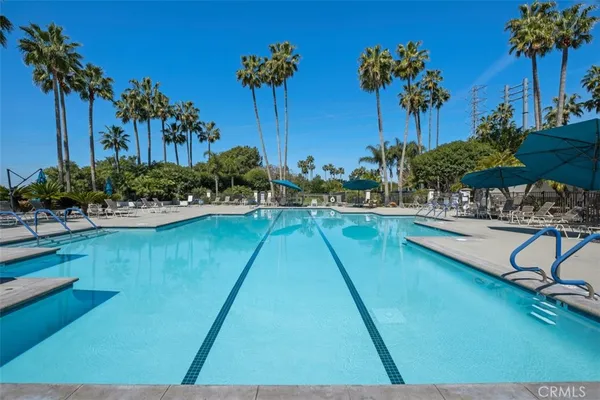 a view of a swimming pool with outdoor seating
