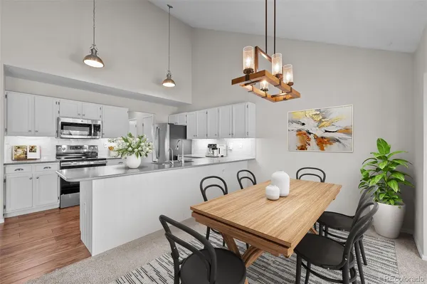 a kitchen with stove cabinets and wooden floor