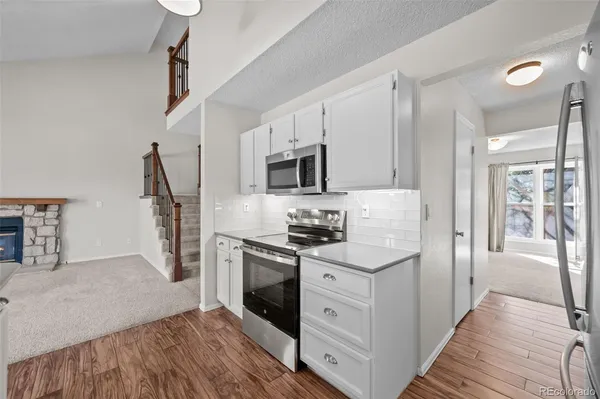 a bedroom with bed and a chandelier