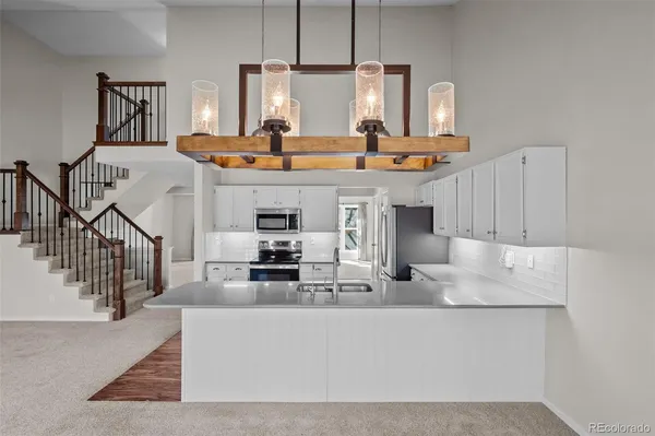 a view of a room that has a table and a chair