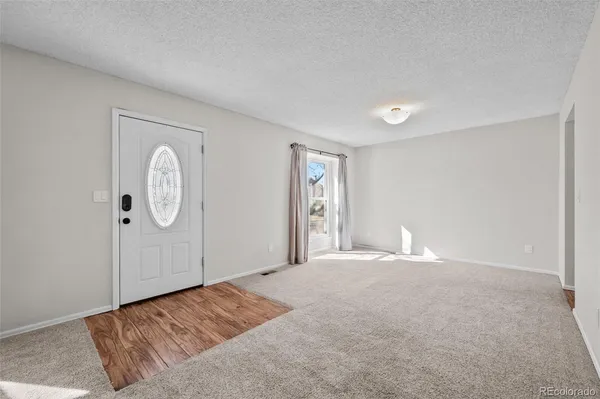 a view of an empty room and window