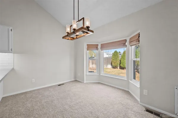 a view of a room with wooden walls