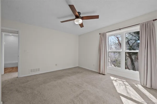 a view of house with backyard and furniture