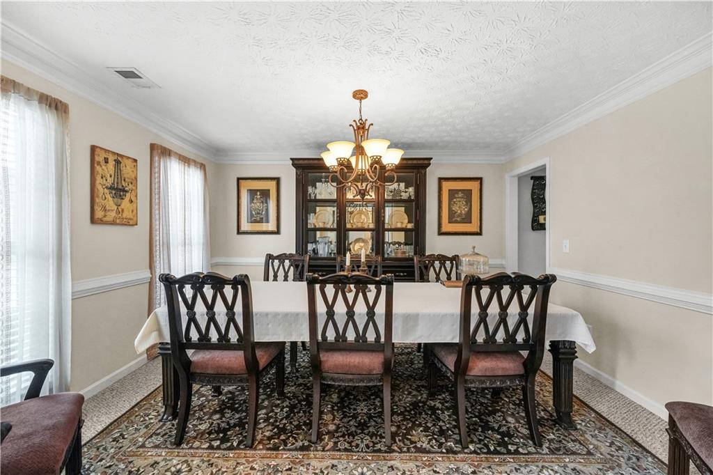 4320 Clarion Drive Conley, GA 30288 - Photo 11 of 49 a view of a dining room with furniture window and wooden floor