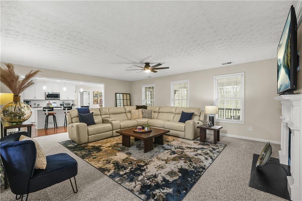 4320 Clarion Drive Conley, GA 30288 - Photo 14 of 49 a living room with lots of furniture and a flat screen tv