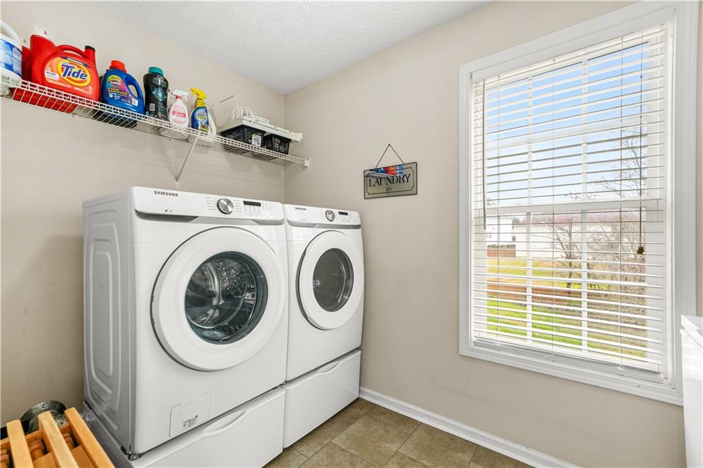 4320 Clarion Drive Conley, GA 30288 - Photo 18 of 49 a utility room with dryer and washer