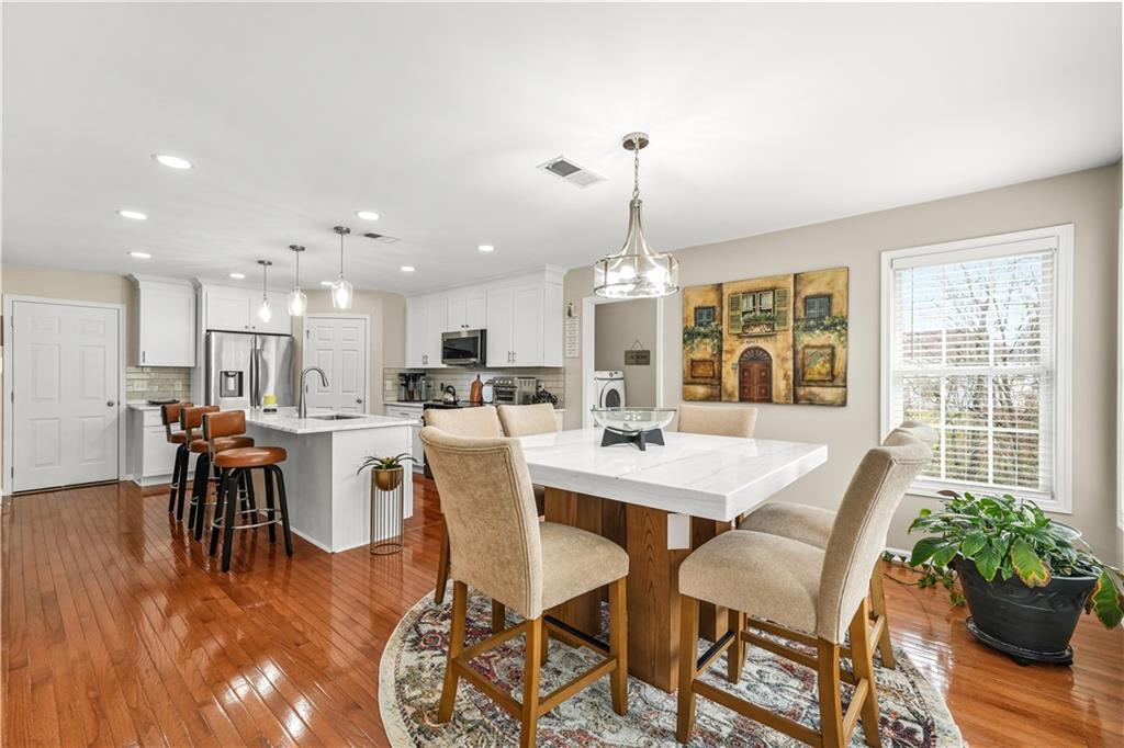 4320 Clarion Drive Conley, GA 30288 - Photo 20 of 49 a view of a dining room with furniture window and wooden floor