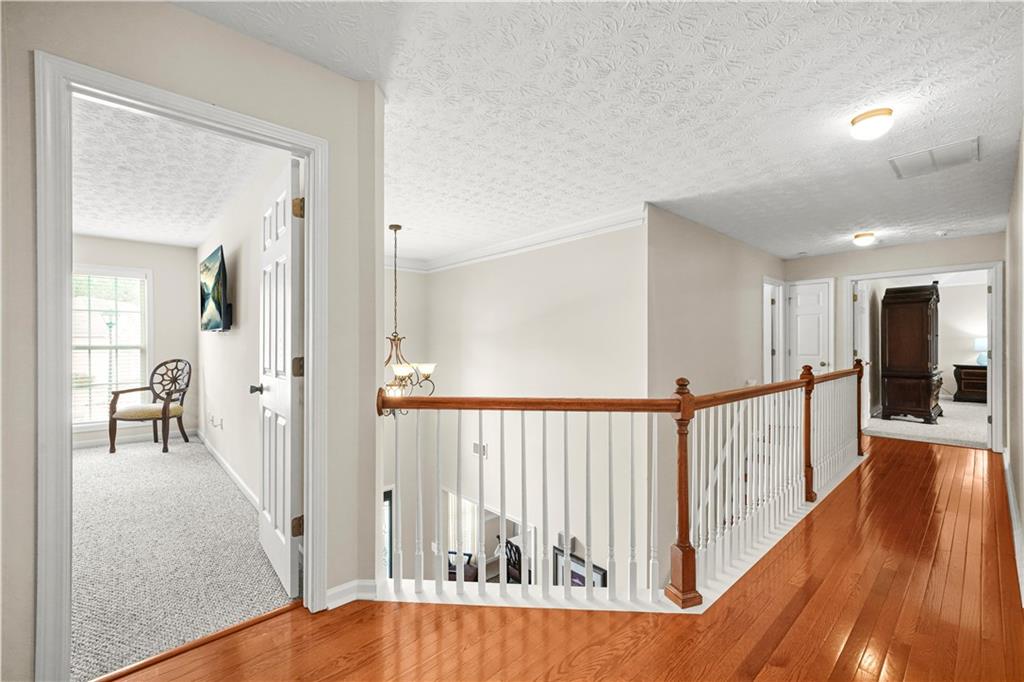 4320 Clarion Drive Conley, GA 30288 - Photo 24 of 49 a view of a hallway with wooden floor and dining room