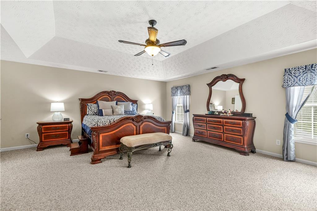 4320 Clarion Drive Conley, GA 30288 - Photo 26 of 49 a bedroom with furniture and a chandelier