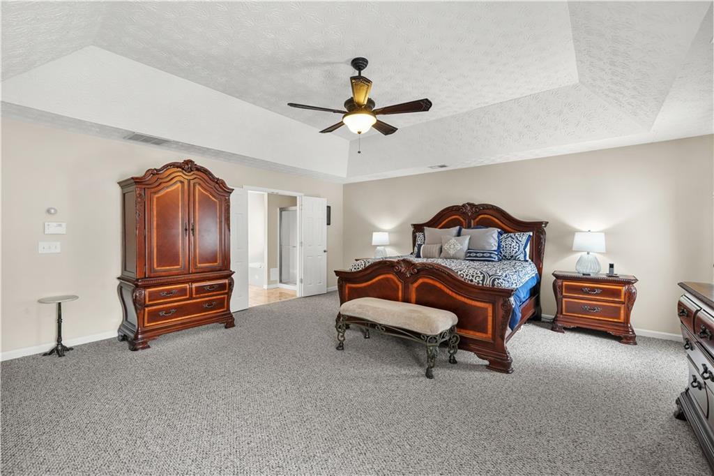 4320 Clarion Drive Conley, GA 30288 - Photo 28 of 49 a bedroom with furniture and a ceiling fan