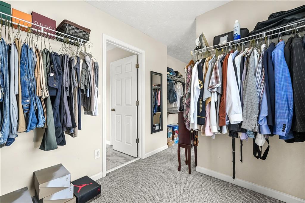 4320 Clarion Drive Conley, GA 30288 - Photo 30 of 49 a view of walk in closet with clothes and shoes