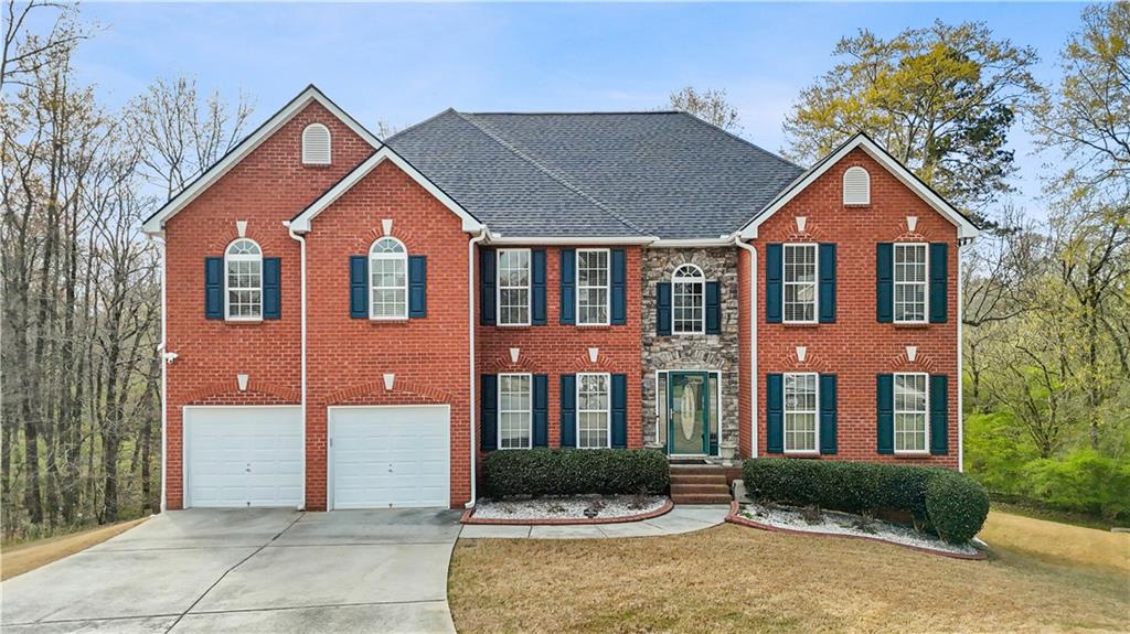 4320 Clarion Drive Conley, GA 30288 - Photo 3 of 49 a front view of a house with garden