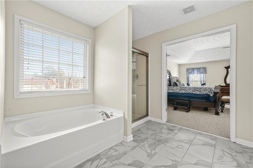 4320 Clarion Drive Conley, GA 30288 - Photo 34 of 49 a bath room with a bath tub and a view living room