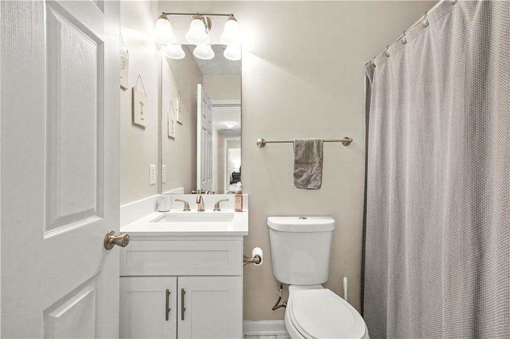 4320 Clarion Drive Conley, GA 30288 - Photo 42 of 49 a bathroom with a sink vanity mirror and toilet