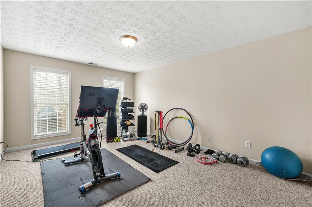 4320 Clarion Drive Conley, GA 30288 - Photo 43 of 49 a room with gym equipment and a window