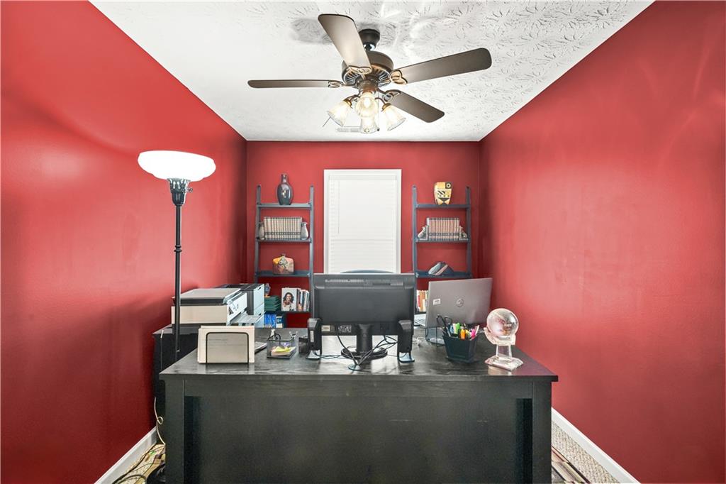 4320 Clarion Drive Conley, GA 30288 - Photo 45 of 49 a dining room with furniture and a chandelier