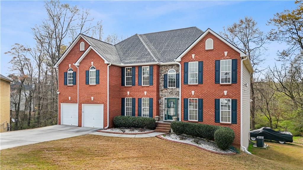 4320 Clarion Drive Conley, GA 30288 - Photo 5 of 49 a front view of a house with a yard