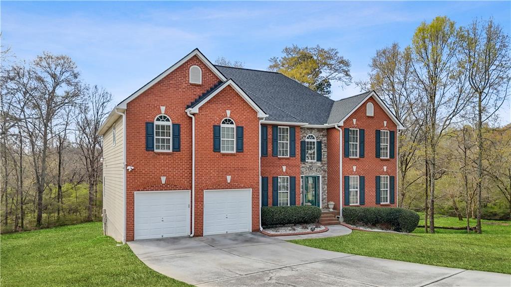 4320 Clarion Drive Conley, GA 30288 - Photo 6 of 49 front view of house with a yard