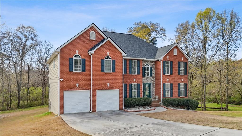 4320 Clarion Drive Conley, GA 30288 - Photo 7 of 49 a front view of a house with a yard