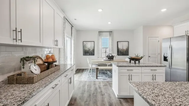 a kitchen with counter top space cabinets and stainless steel appliances