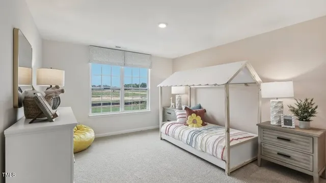 a bedroom with bed and window