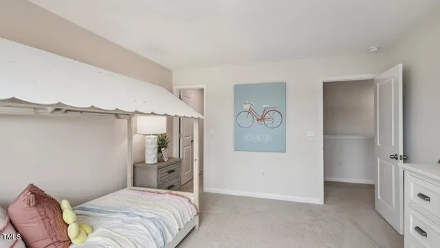 a bedroom with a bed and a table