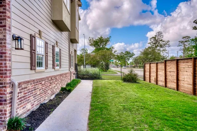 a view of a pathway with a garden