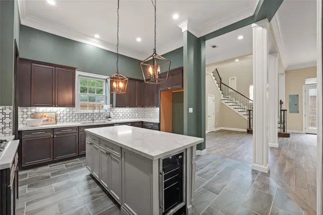 a kitchen with a stove a sink and a refrigerator