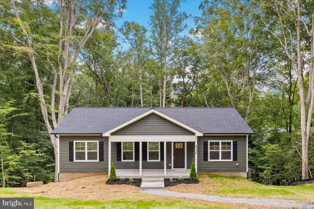 a view of a lake with houses in the back