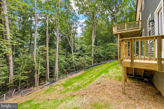 a view of a swimming pool with an outdoor space and seating area