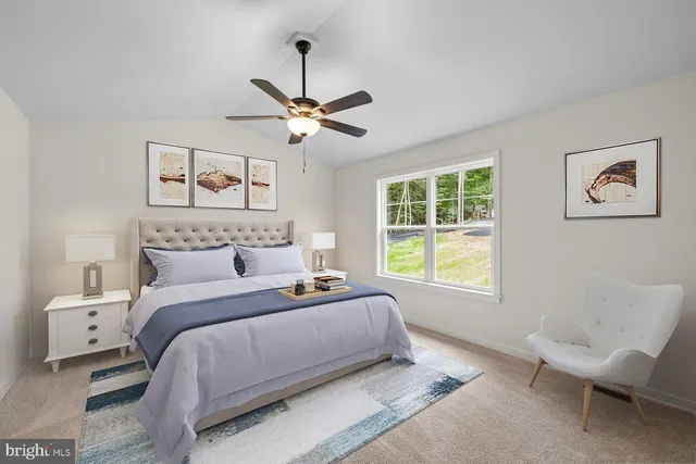 a view of a kitchen with furniture and a ceiling fan