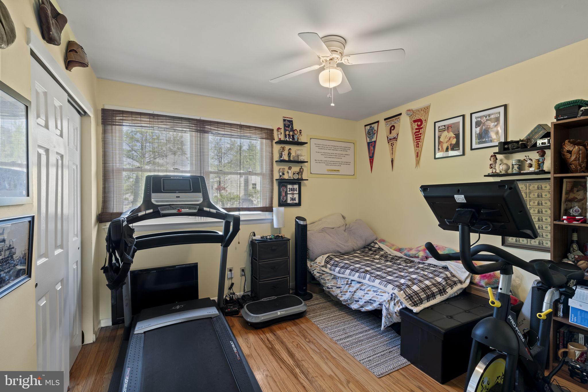436 Carver Avenue Lawnside, NJ 08045 - Photo 15 of 32 a bedroom with a bed and a chandelier