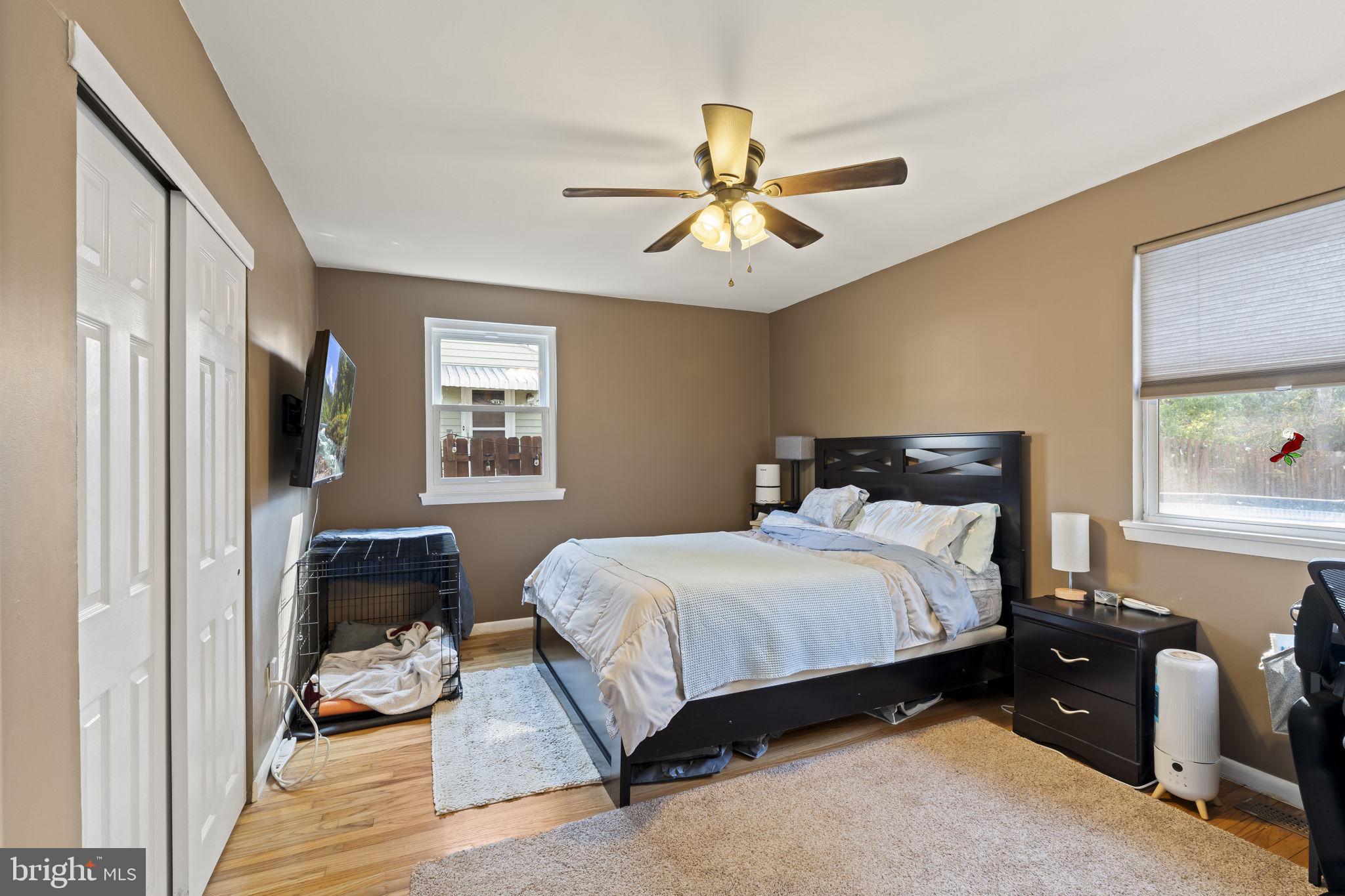 436 Carver Avenue Lawnside, NJ 08045 - Photo 19 of 32 a bedroom with a bed gym equipment and a window