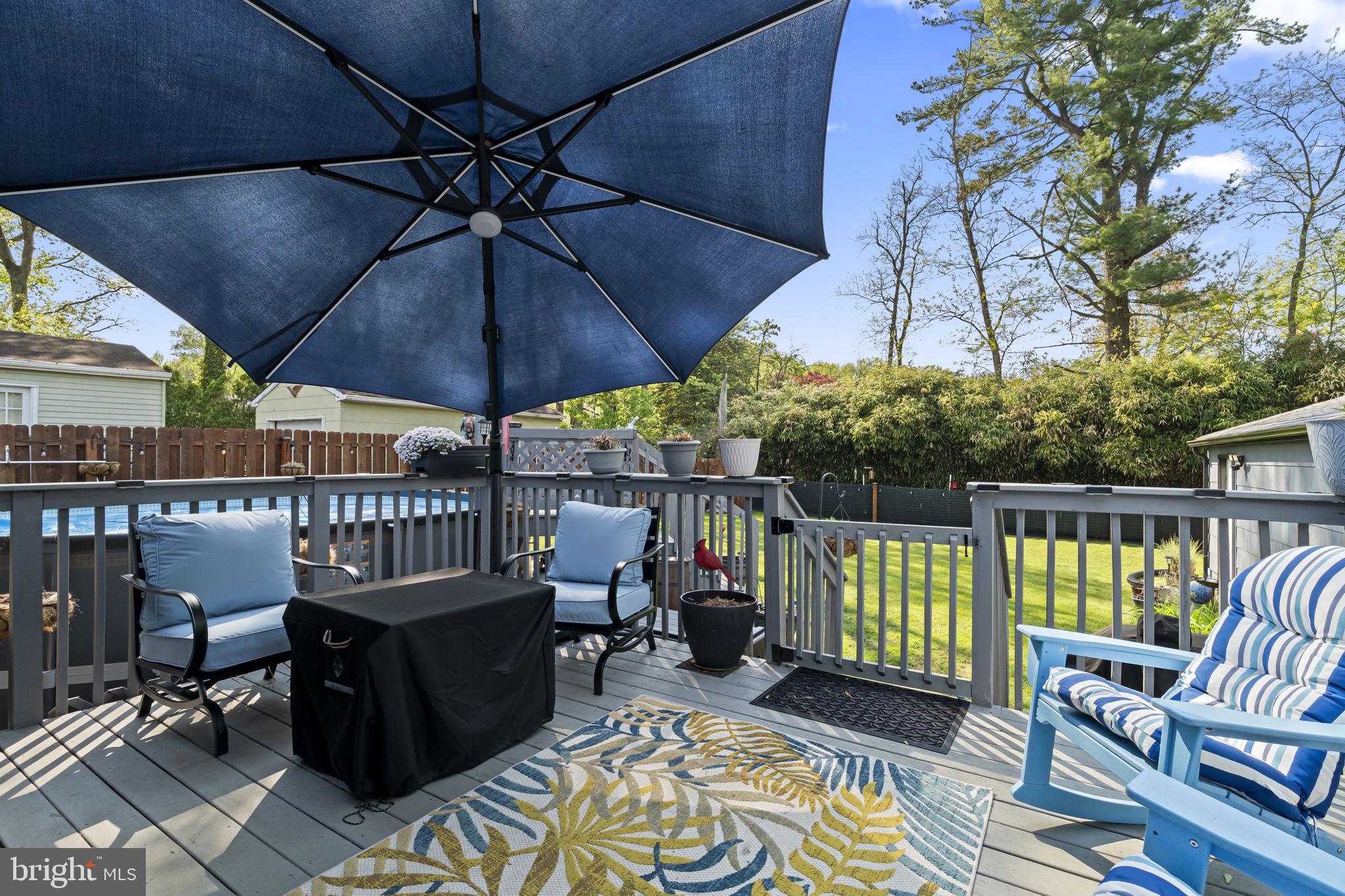 436 Carver Avenue Lawnside, NJ 08045 - Photo 25 of 32 a view of a balcony with furniture and umbrella