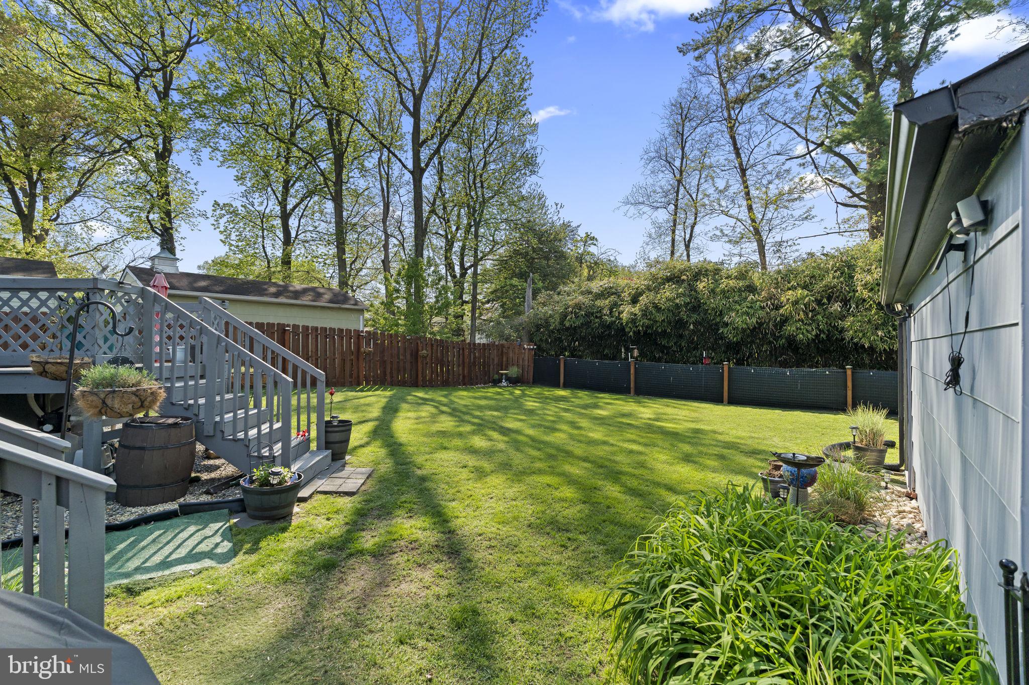 436 Carver Avenue Lawnside, NJ 08045 - Photo 29 of 32 a view of a backyard with couches chair and wooden fence