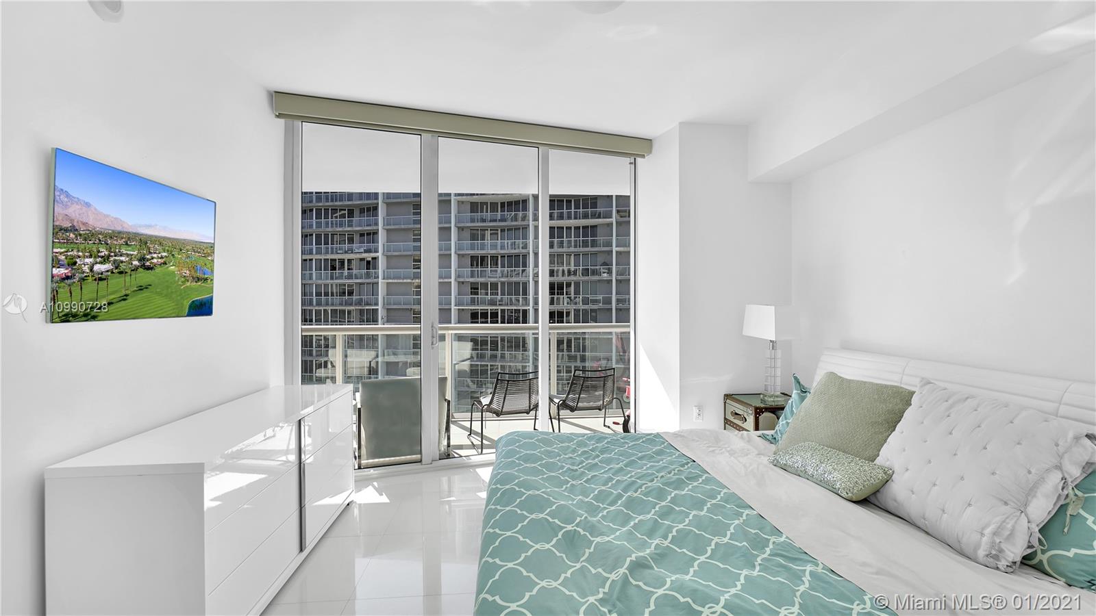 475 Brickell Avenue, Unit 5109 Miami, FL 33131 - Photo 16 of 31 a bedroom with a bed and a window