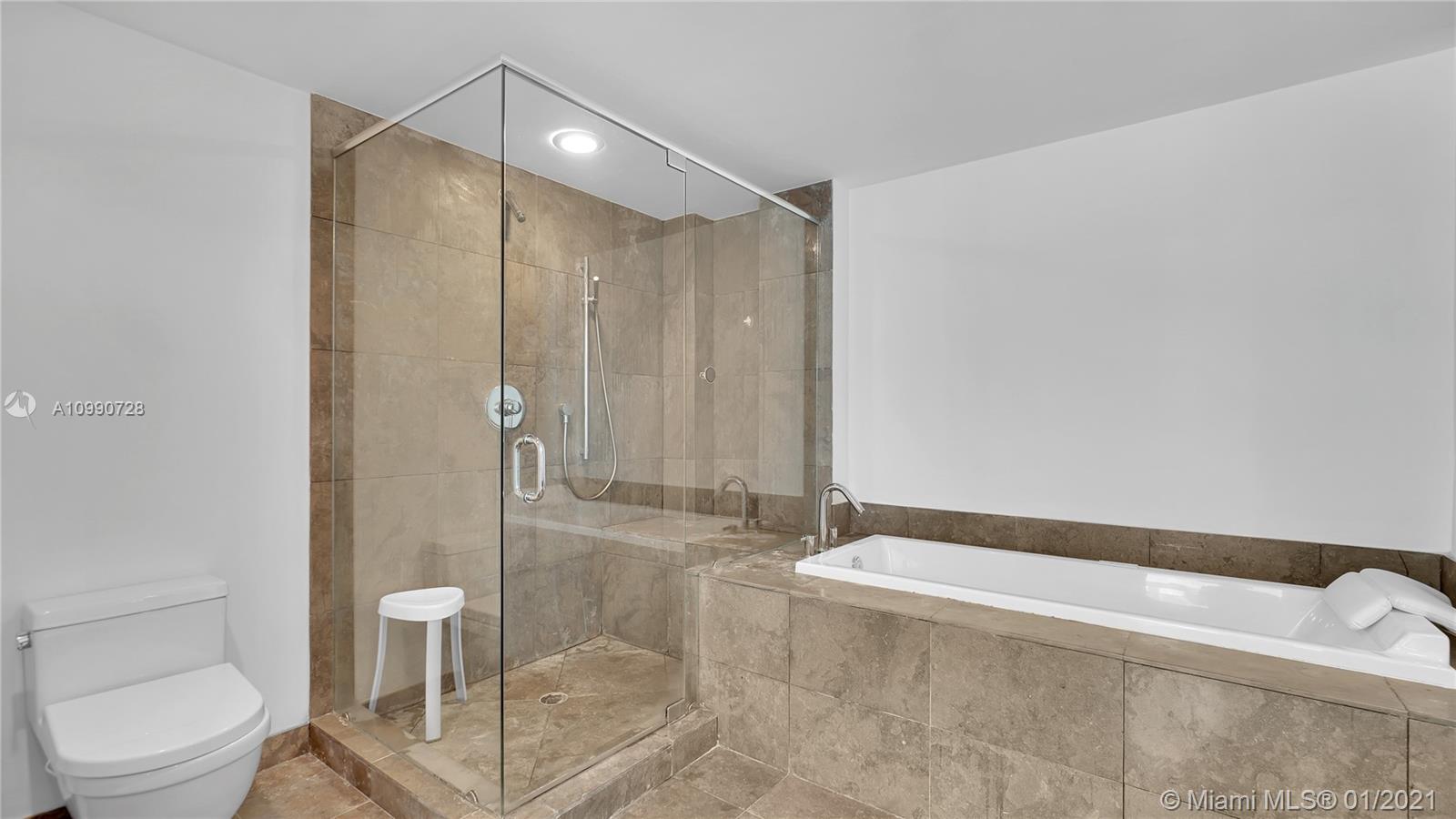 475 Brickell Avenue, Unit 5109 Miami, FL 33131 - Photo 19 of 31 a bathroom with a shower and a toilet