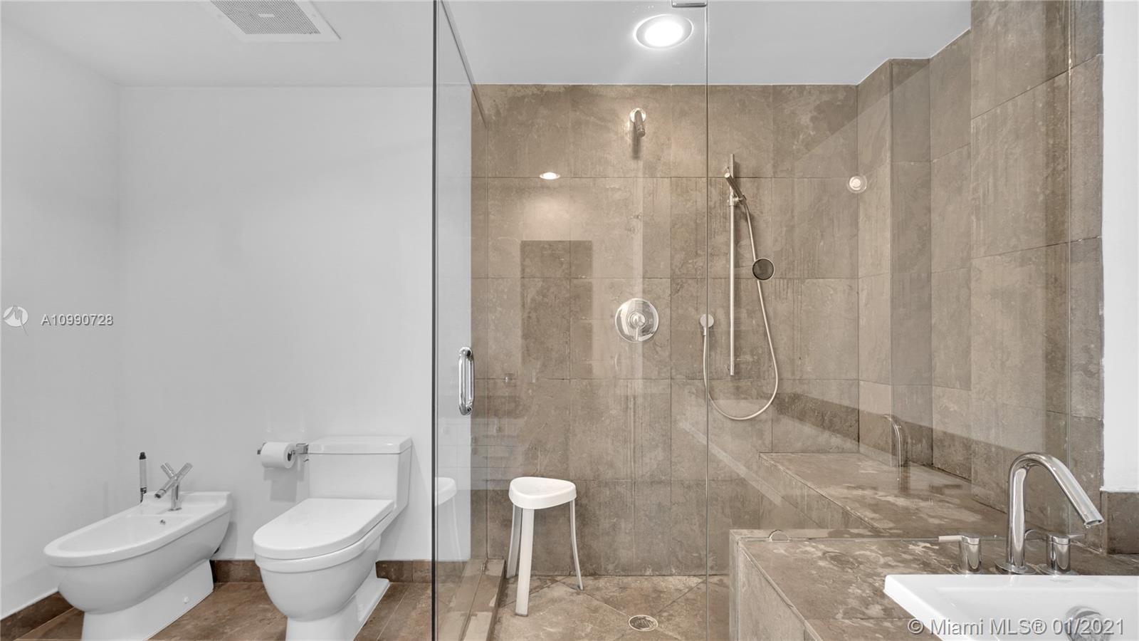 475 Brickell Avenue, Unit 5109 Miami, FL 33131 - Photo 20 of 31 a bathroom with a granite countertop sink toilet and shower