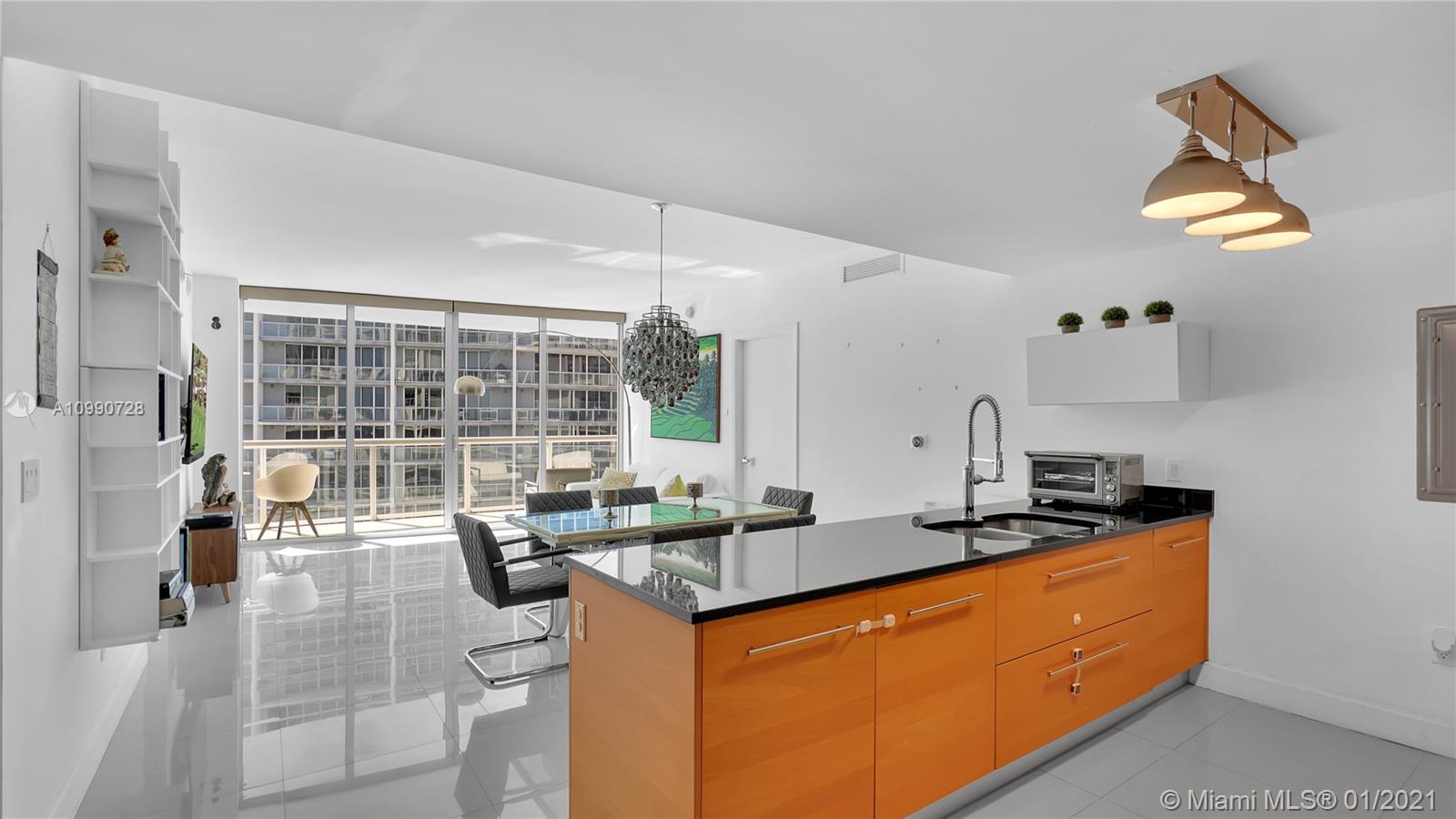 475 Brickell Avenue, Unit 5109 Miami, FL 33131 - Photo 4 of 31 a kitchen with stainless steel appliances granite countertop a sink a stove and a refrigerator