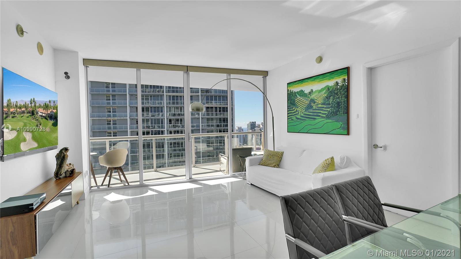 475 Brickell Avenue, Unit 5109 Miami, FL 33131 - Photo 5 of 31 a view of a living room and dining room