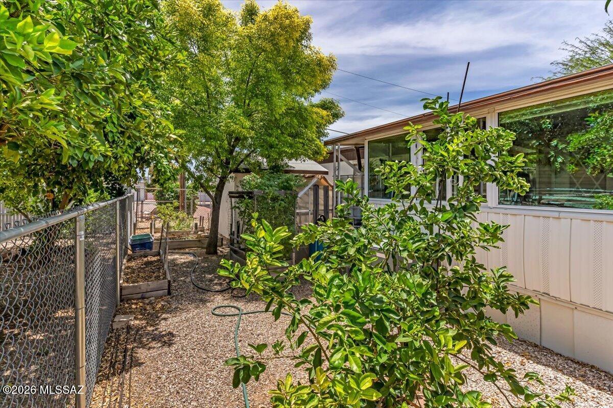 5379 West Rafter Cir Street Tucson, AZ 85713 - Photo 30 of 38 a backyard of a house with table and chairs
