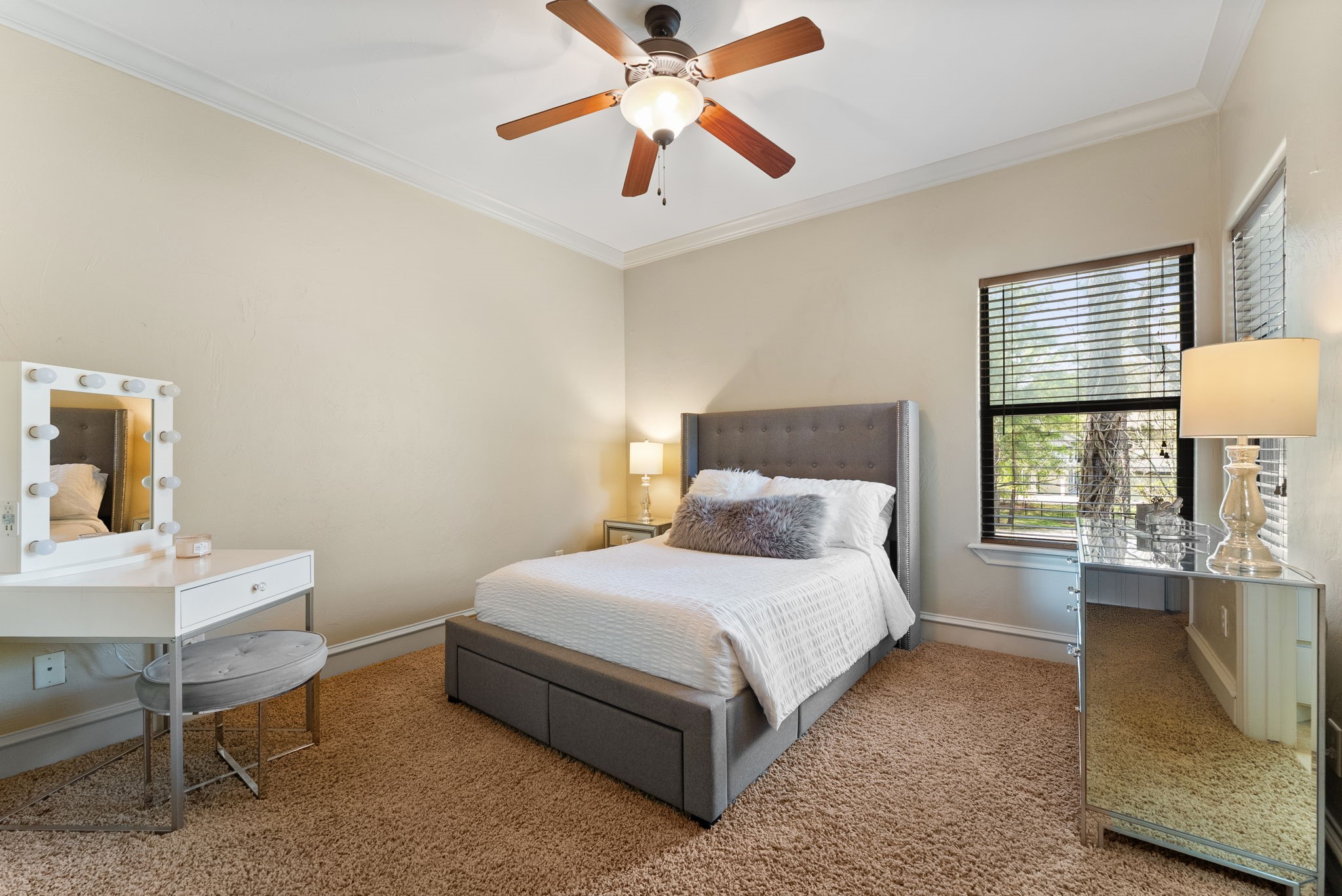 3907 Rayford Road Spring, TX 77386 - Photo 24 of 38 One of two upstairs bedrooms, this room features crown molding, a ceiling fan, double door closet entry with built-in shelving, and its own private en-suite bath.