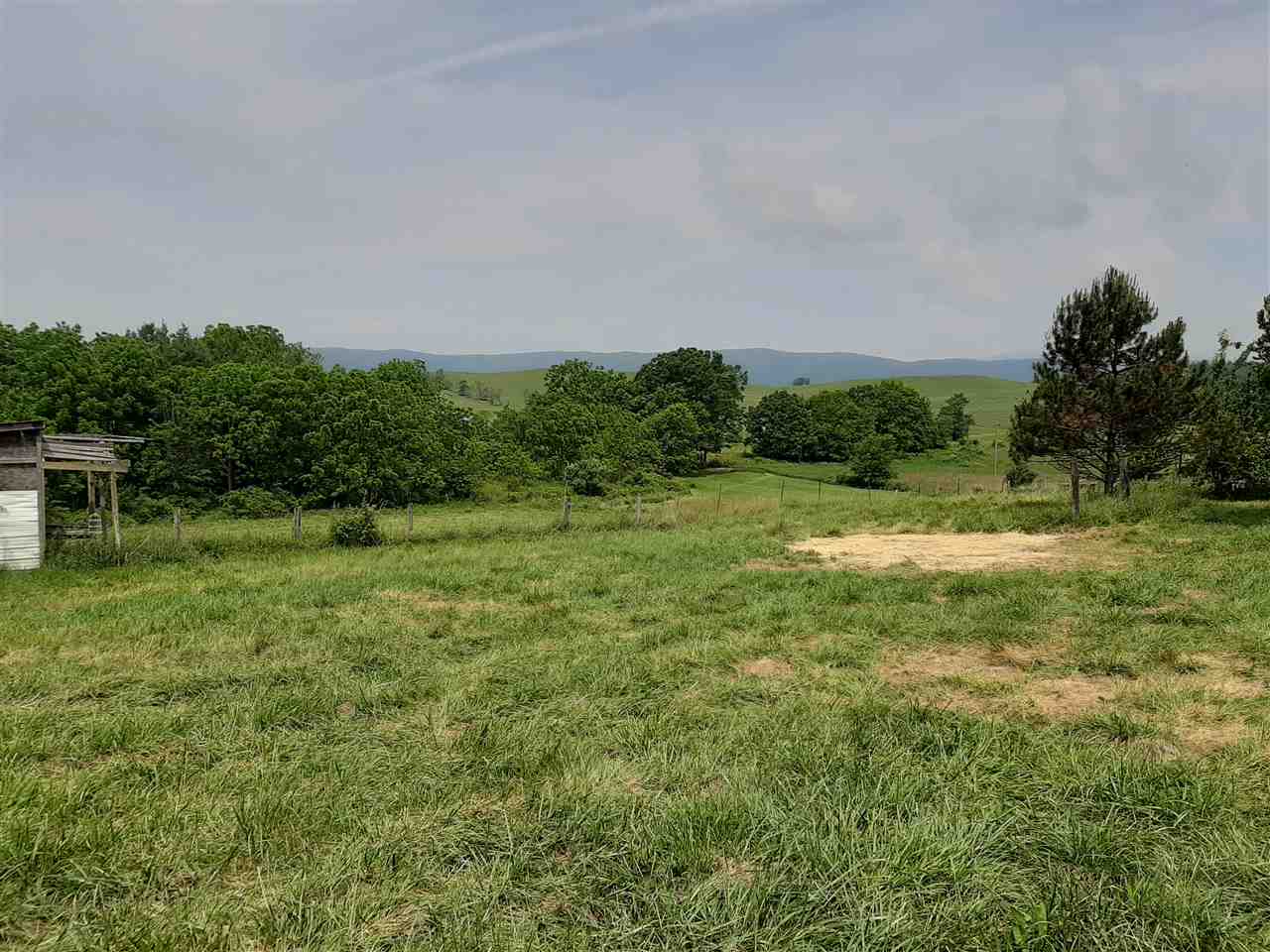 227 Cherry Grove Road Middlebrook, VA 24459 - Photo 7 of 15 a view of a green field with wooden fence