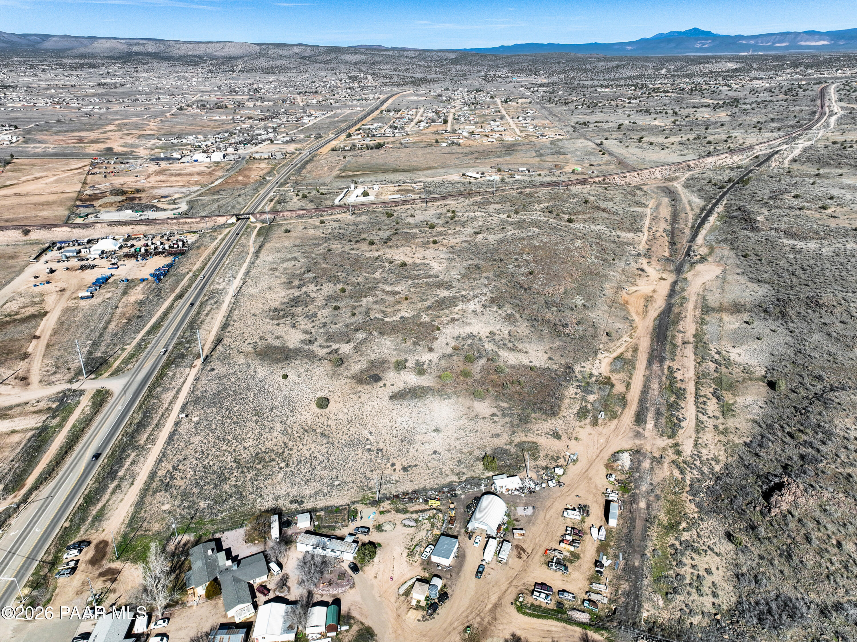 6.87 Acres N State Route 89 Paulden, AZ 86334 - Photo 5 of 11 a view of a dry yard with wooden fence