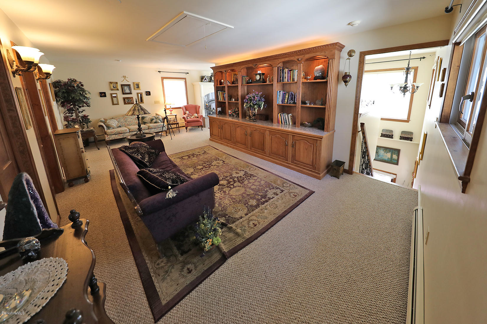142 Kibbe Road Otis, MA 01029 - Photo 15 of 28 a living room with furniture a flat screen tv and a large window